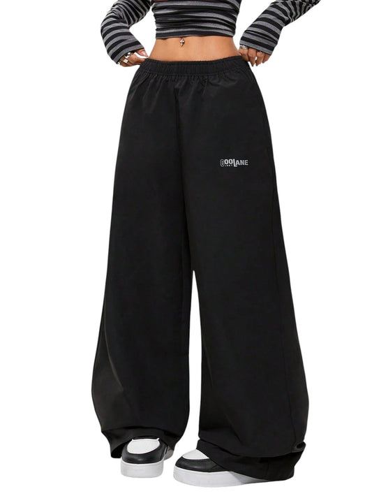 SHE fekete logó mintás bő nadrág