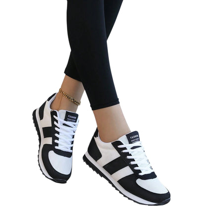 SHE fekete fehér csíkos hálós sportcipő